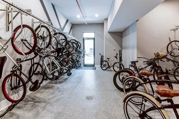 A bike rack with many bikes on it at Mayla Pompano, Pompano Beach, 33062